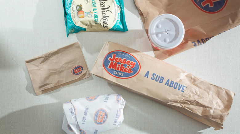 Jersey Mike's to-go sandwich with chips and drink