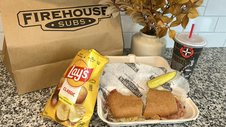 Firehouse gluten free sub with chips and a drink