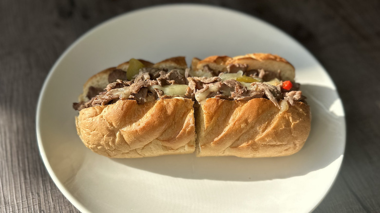 Firehouse Subs steak and cheese melt split in half on plate