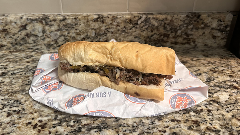 Jersey mike's philly cheesesteak on wrapper on counter