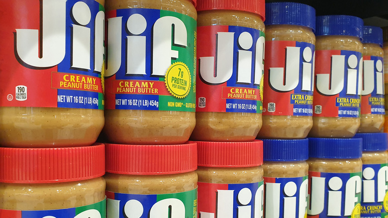Jars of Jif Peanut Butter on a grocery store shelf