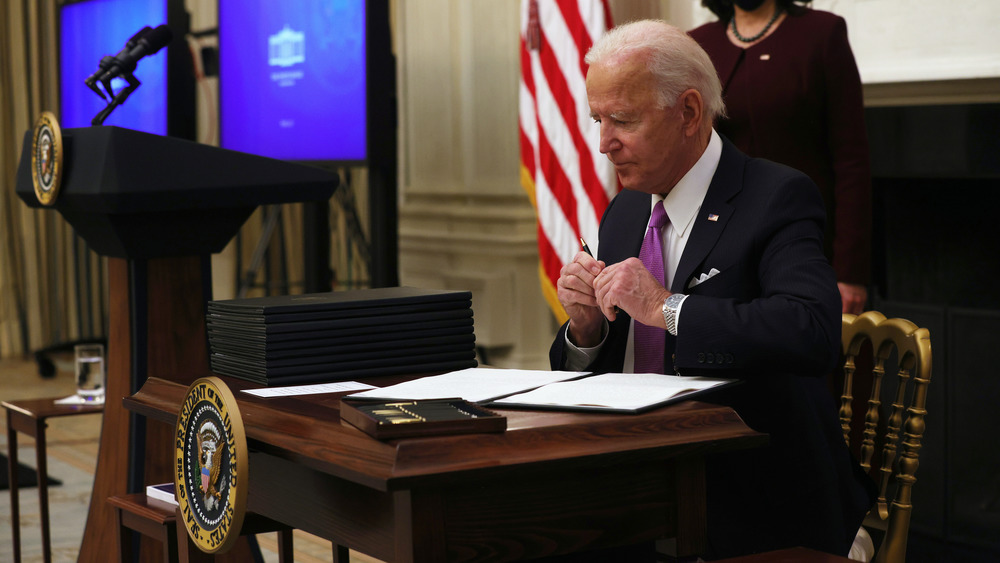 Joe Biden signing papers