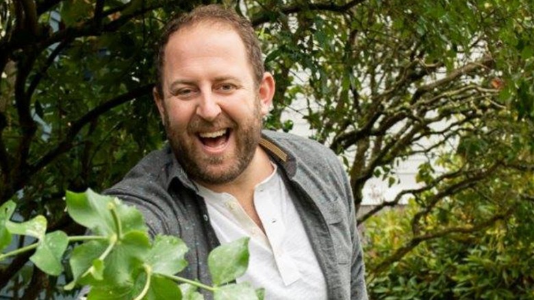 Joel Gamoran holding batch of leaves