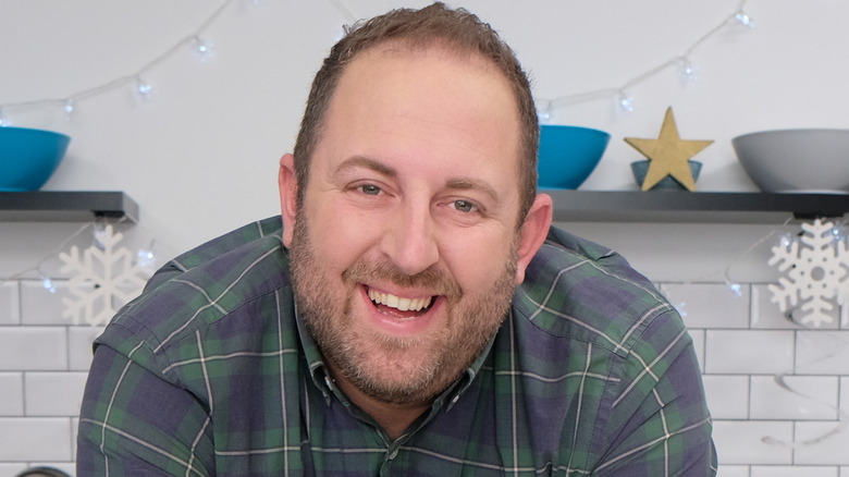 Joel Gamoran smiling in the kitchen