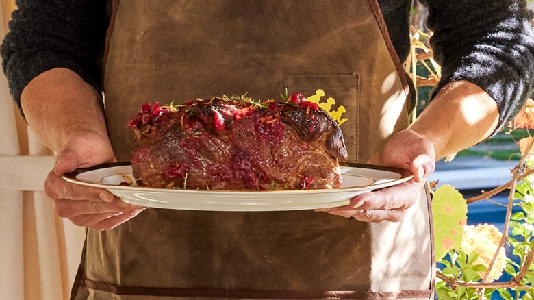 Joel McHale holds his Cranberry-Orange Whisky-Glazed Pork 