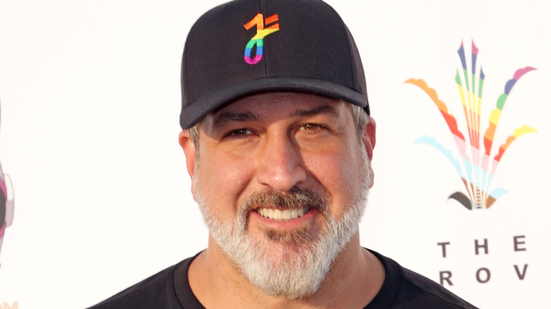 Joey Fatone in rainbow colored hat