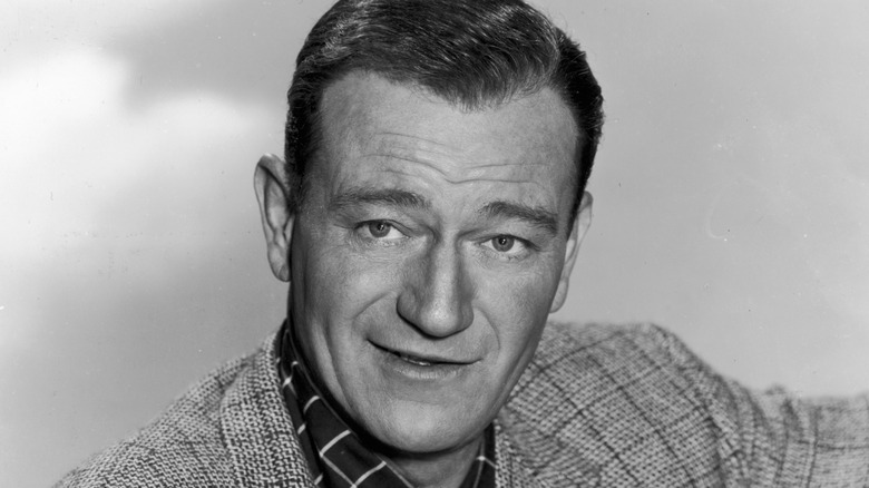 John Wayne posing in a black and white photo