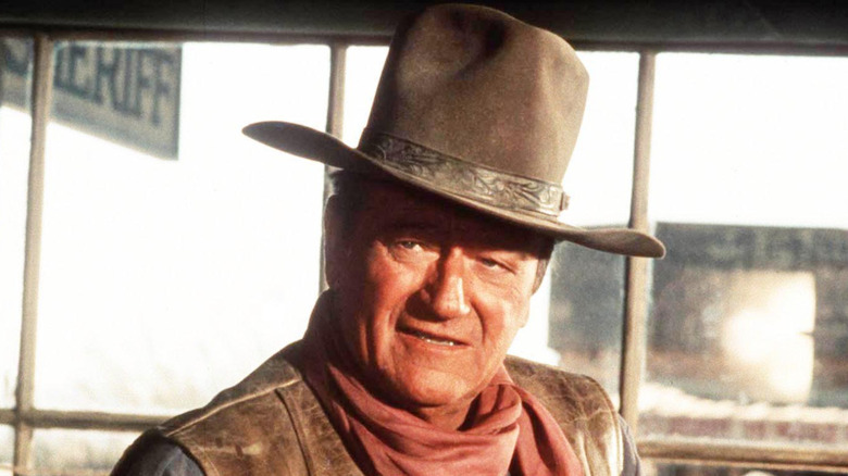 John Wayne in cowboy film.