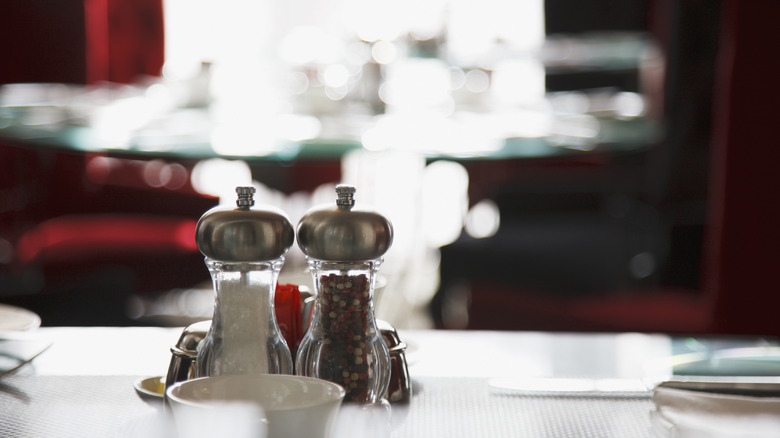 Salt and pepper shakers in restaurant