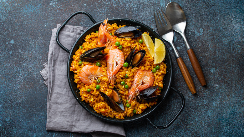 Paella in a black pan