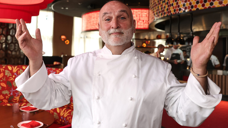 José Andrés holding arms in the air