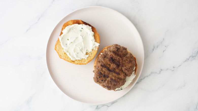 Open lamb burger with goat cheese spread
