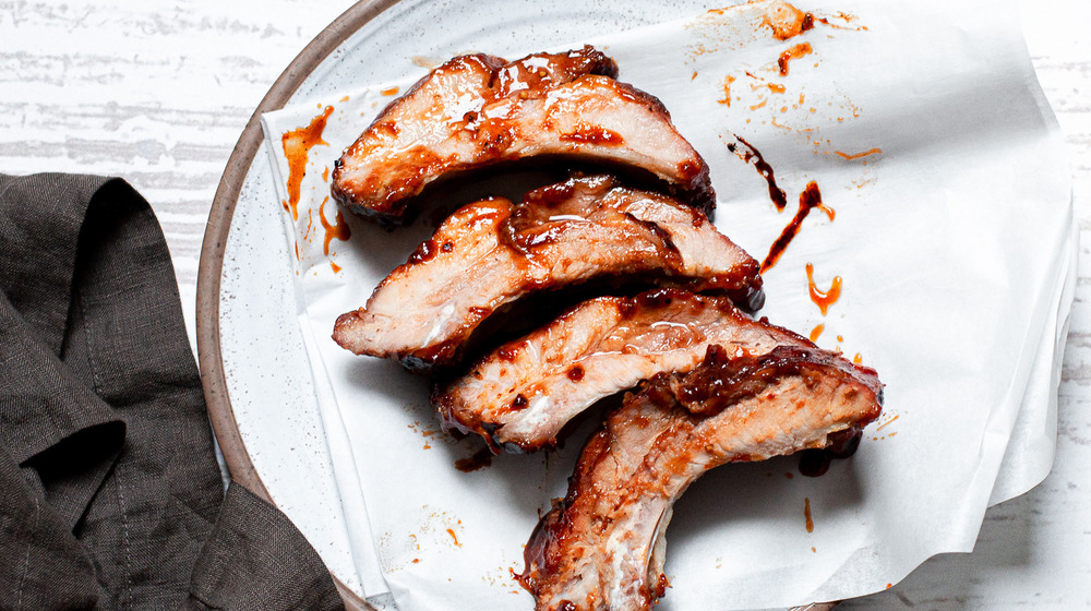 Juicy Slow Cooker Ribs covered in BBQ sauce