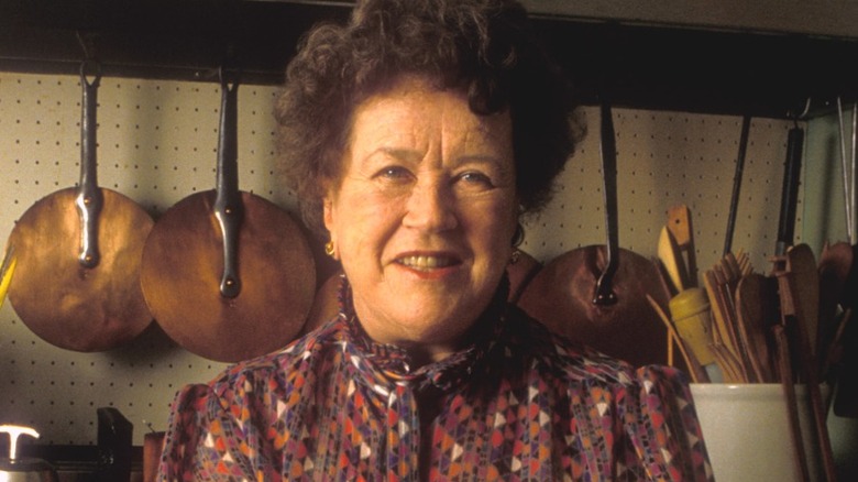 Julia Child smiling in her kitchen