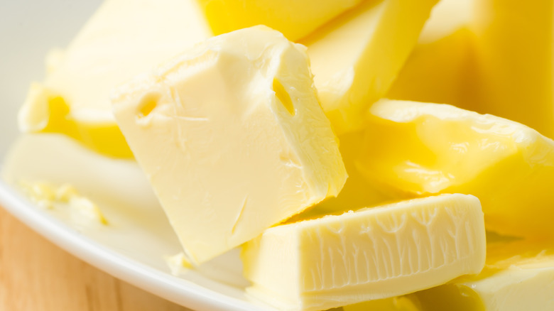 pats of butter on a plate
