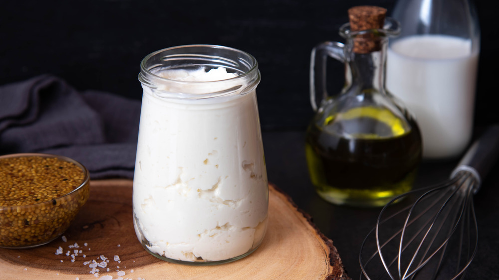 Homemade mayonnaise, the BEST MAYO, surrounded by its ingredients.