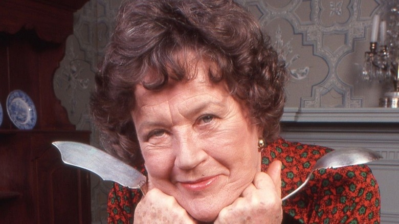 Julia Child holding cutlery  