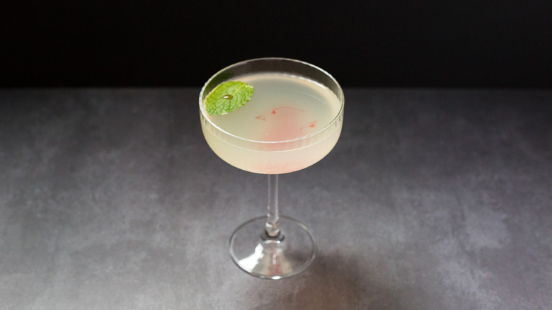 garnished cocktail on gray background