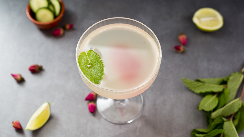 garnished cocktail on gray background