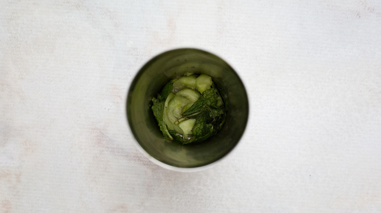 mint and cucumber in shaker