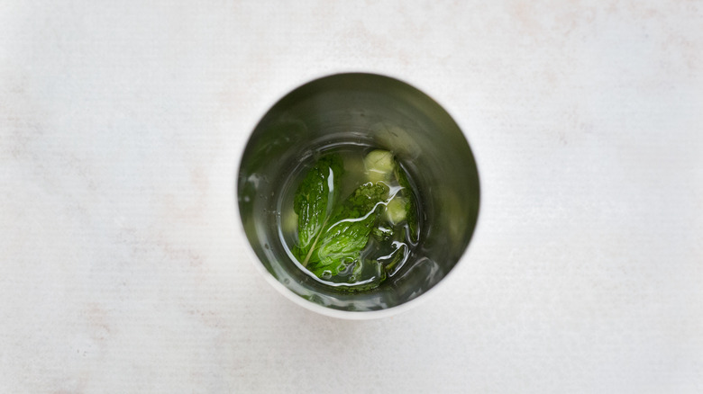 cocktail ingredients in metal shaker
