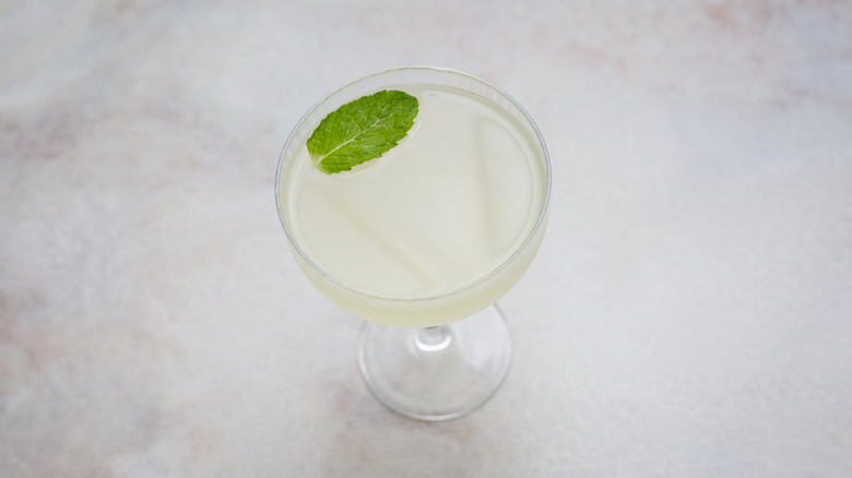 garnished cocktail on marble table