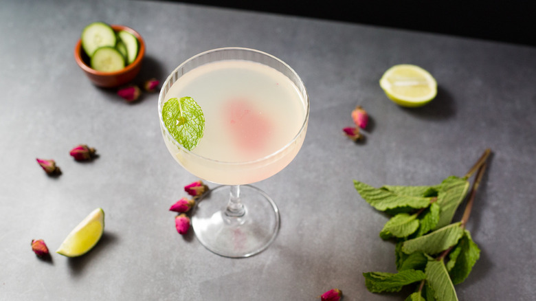 garnished cocktail on gray background