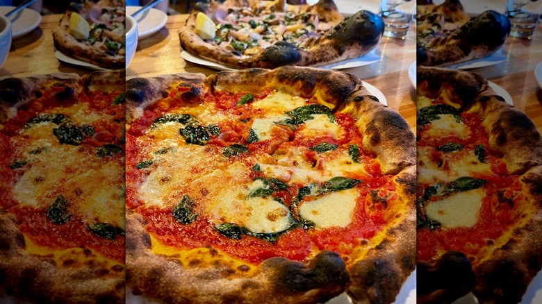 Pizza on table at In Bocca al Lupo.