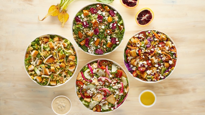 four salad bowls from Just Salad summer menu