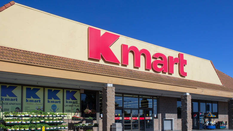 Classic Kmart storefront with plants and signage