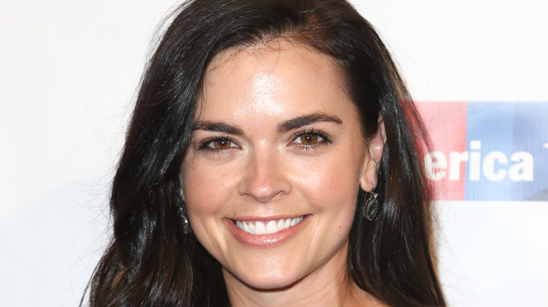 Katie Lee Biegel smiles with hair down