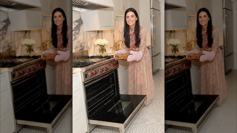 Katie Biegel taking food from oven