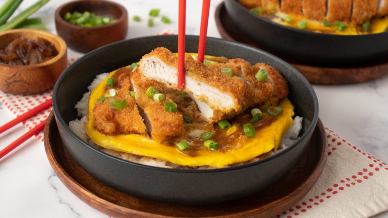 katsudon in bowl with chopsticks