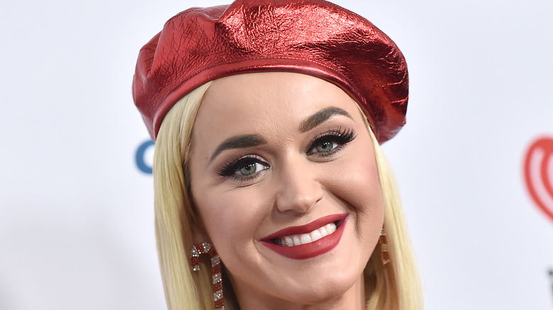 Close up of Katy Perry in red hat