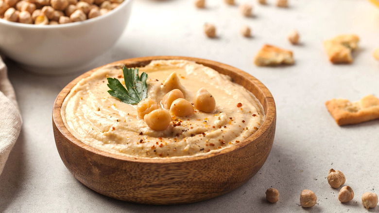 Hummus in wooden bowl