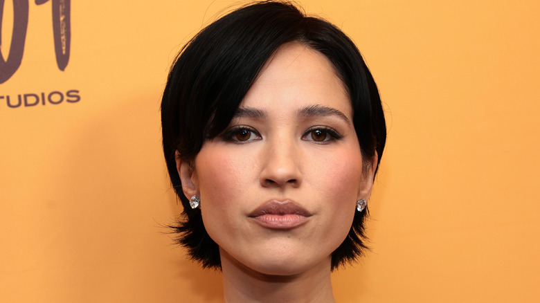 Kelsey Asbille against an orange background