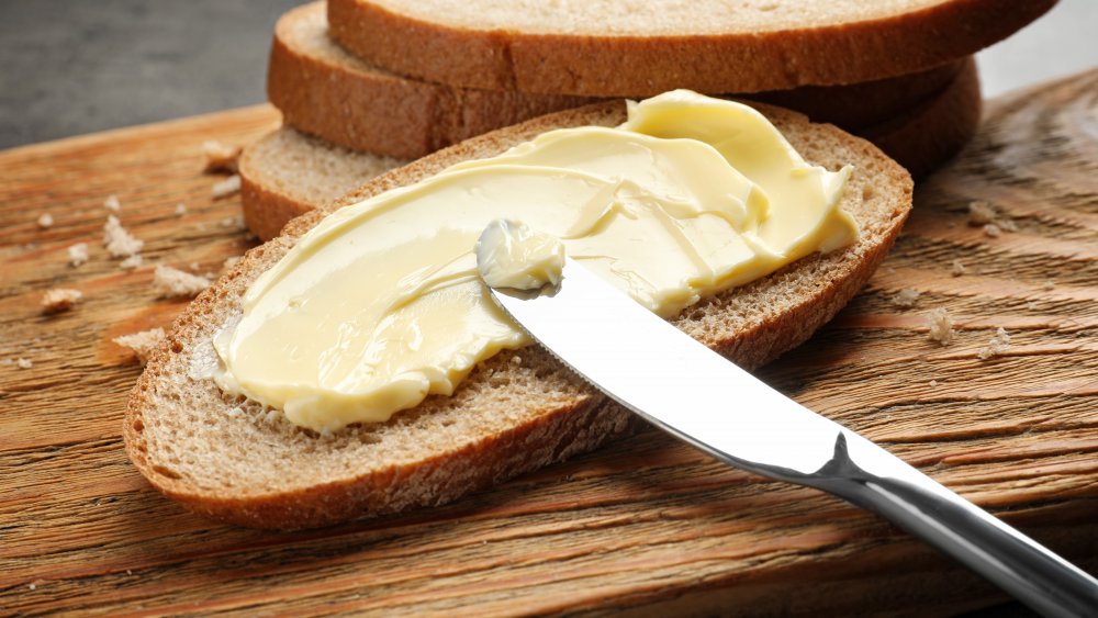 Slice of bread spread thickly with butter