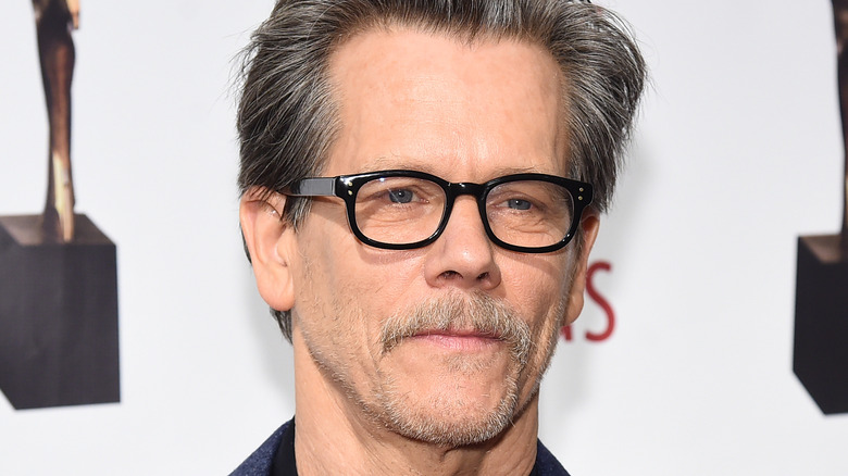 Kevin Bacon wearing glasses