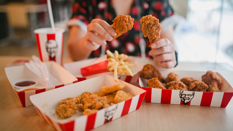 person holding KFC chicken