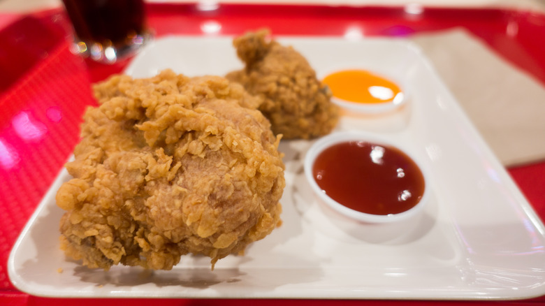 Fried chicken with dipping sauces on plate