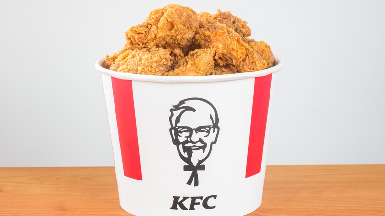 Golden fried chicken in a KFC bucket