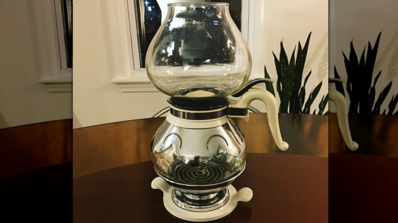 Glass vacuum coffee pot with white handle