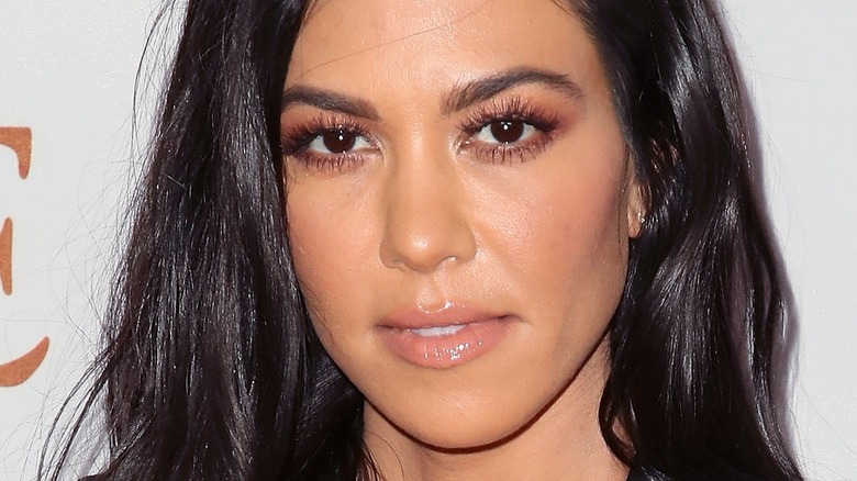 KOURTNEY KARDASHIAN wearing lip gloss