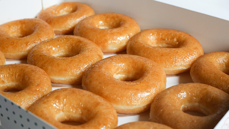 a dozen krispy kreme glazed donuts