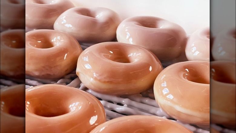 Krispy Kreme glazed doughnut sitting on a rack
