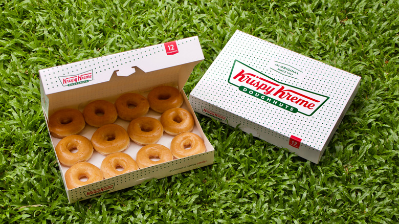 Two Krispy Kreme doughnut boxes