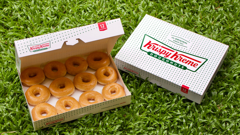 Two boxes of Krispy Kreme doughnuts