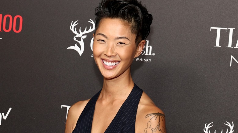 Kristen Kish smiling at a red carpet event.