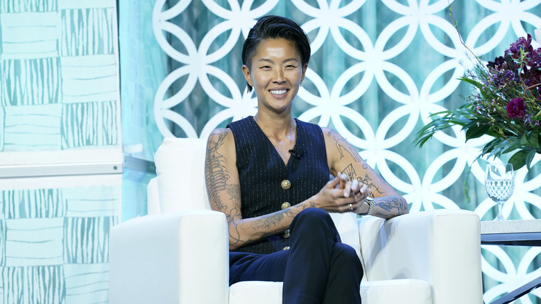 Kish sitting at conference