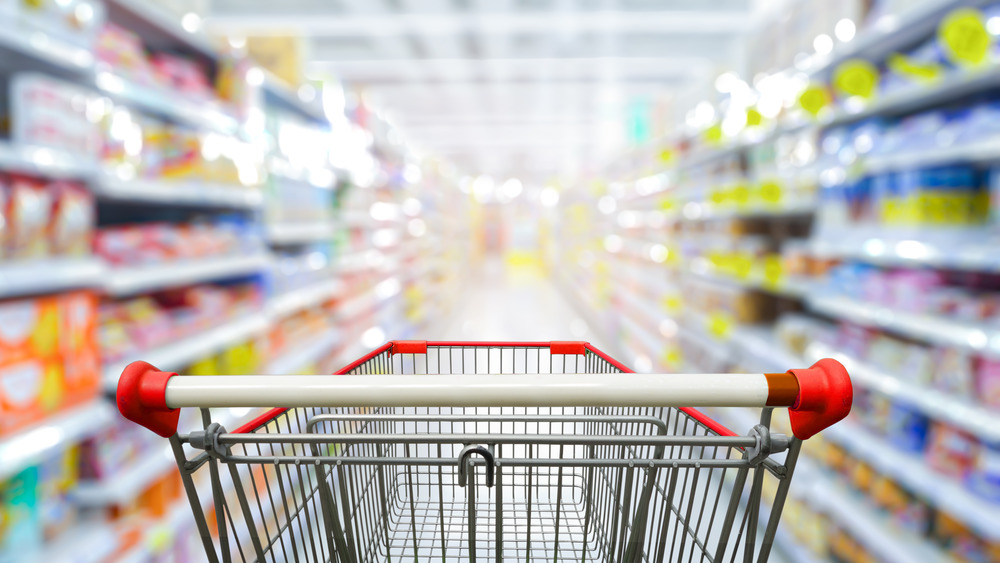 Shopping cart in grocery aisle